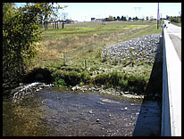 SE corner river access at CR S 650 W bridge